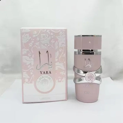 Woman applying yara lattafa perfume with a confident expression